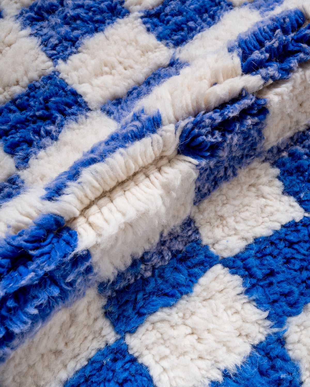 Modern, designer, handcrafted Berber rug from Morocco. Beniourain carpet with beautiful colours and patterns and fluffy wool texture.
